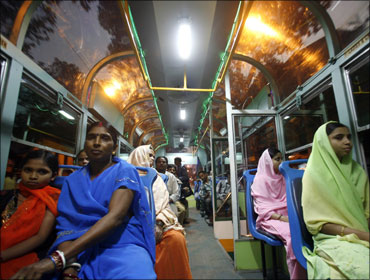 Passengers in a Kolkata Metro compartment.