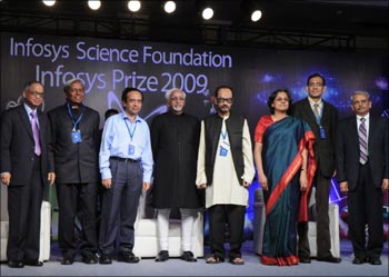 Infosys Prize winners along with Vice President Hamid Ansari, Infosys chief mentor N R Narayana Murthy (left extreme) and Infosys CEO S Gopalakrishnan (extreme right).