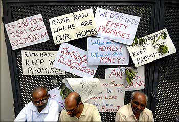 Investors protest against Raju.