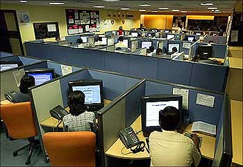 Indian employees at a call centre provide service support to international customers.