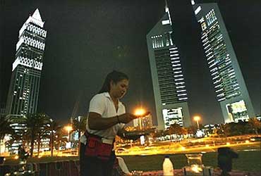 A waitress serves at Ziara Ramadan tent near the Emirates towers in Dubai.