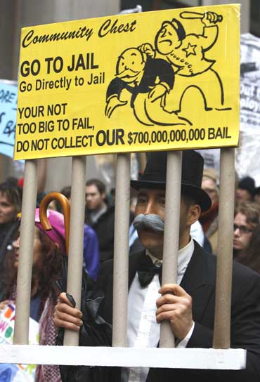 Protesters march through New York's financial district during a rally against government bailouts.