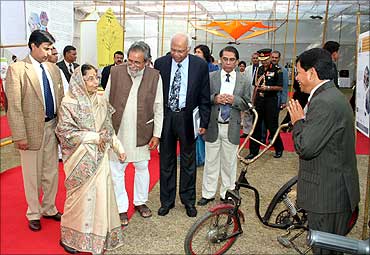 President Pratibha Patil looks at Gogoi's cycle.
