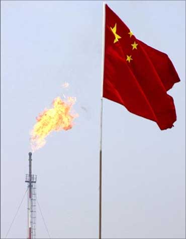 A Chinese flag flutters at the Jidong Nanpu oilfield in Bohai Bay.