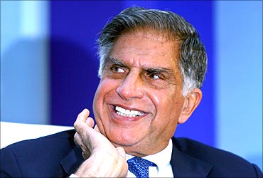 Ratan Tata smiles during an industry conference.