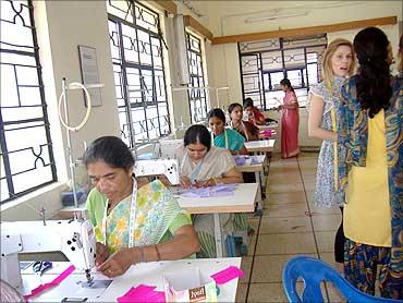 Women get training in tailoring.