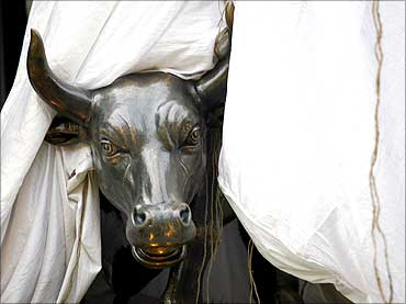 A bronze replica of a bull is seen at the gates of the Bombay Stock Exchange.
