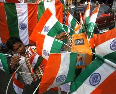 A boy sells Indian flags.