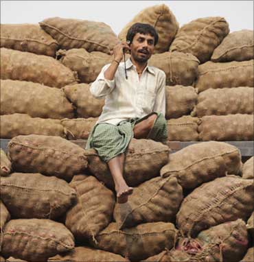 A labourer speaks on his mobile phone.