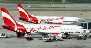 Air Asia CEO Tony Fernandes answers a question during a news conference in central Sydney.