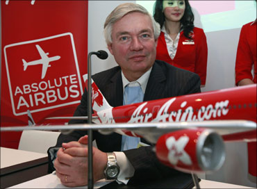 Airbus sales chief John Leahy poses with an Airbus model.
