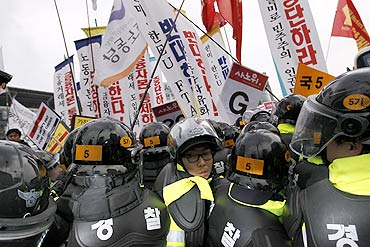 South Korean police struggle to stop demonstrators during an anti-G20 protest in downtown Seoul.
