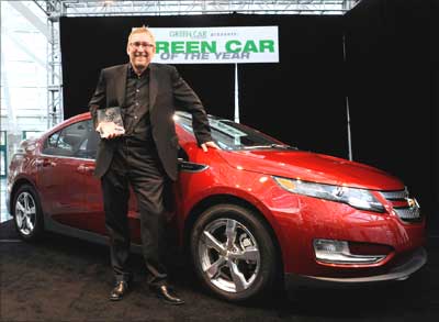 General Motors Co's US marketing chief Joel Ewanick accepts the 2011 Green Car of the Year Award for the Chevrolet Volt.