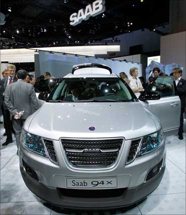 Visitors look at the SAAB 9-4X Crossover.