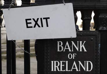 A sign hangs on the railings of the Bank of Ireland, in central Dublin