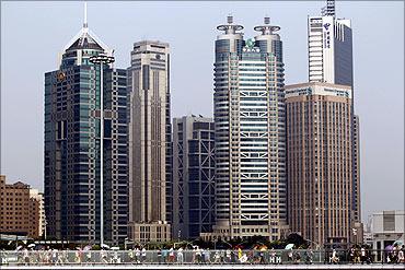 People walk through the Lujiazui Financial Area in Shanghai.