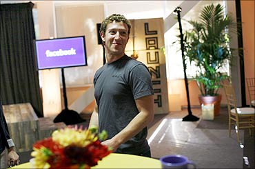 Facebook CEO Mark Zuckerberg walks through Facebook headquarters prior to unveiling the company's new location services feature called 'Places' at a news conference in Palo Alto, California.