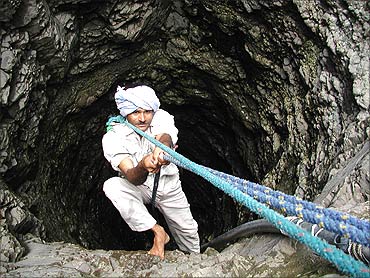 A man climbs out of a well in the village of Chuda Chokadi 150 km west of Ahmedabad.