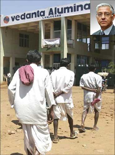 Villagers walk towards the main gate of Vedanta Alumina refinery in Lanjigarh near Bhubaneswar. Inset: Kuldip K Kaura, director, Sesa Goa.