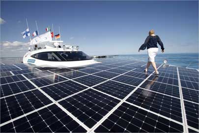 A woman walks on the deck of the world's largest solar-powered boat -- The Turanor Planet Solar.