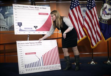 A US staffer places charts in place on stage.