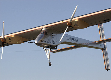 Solar Impulse's CEO and pilot Andre Borschberg performs a low altitude go-round procedure at Payerne airport April 18, 2011.