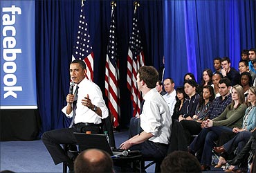 Obama at Facebook headquarters with CEO Mark Zuckerberg.