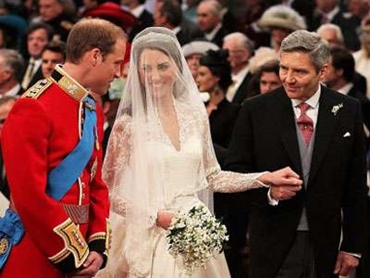 Prince William stands at the altar with his bride, Kate Middleton, and her father Michael.