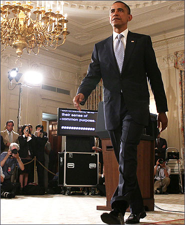 US President Barack Obama leaves after he made a statement at the State Dining Room.