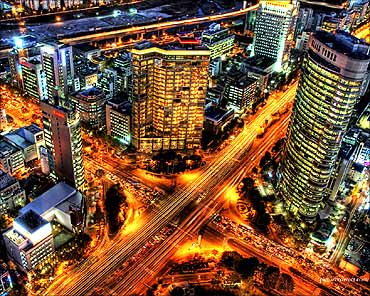 Seoul's roads shine under the lights.