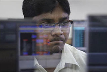 A broker monitoring the stock prices.