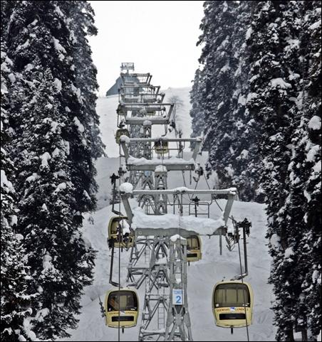 Skiers and tourists use cable car gondolas to reach upper reaches of Gulmarg, 55 km west of Srinagar.