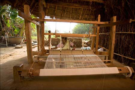 Hand weaving the Malkha fabric.