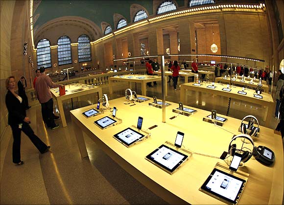 Apple's iPad tablets and iPhones are displayed inside the newest Apple Store in New York City's Grand Central Station.