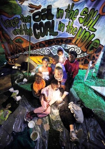 Environmental activists hold a candlelight vigil outside the United Nations Climate Change Conference.