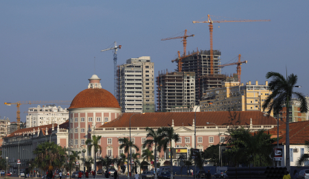 Office blocks under construction stand behind the Angolan central bank building in the capital Luanda.