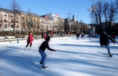 People ice skate on the rink on Karl Johann Street in Oslo.