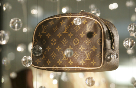 A luxury leather bag hangs on display at the Beverly Center shopping mall in Los Angeles.