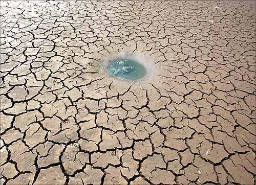 A view of a partially dried-up pond at a village of Guangnan county, China.