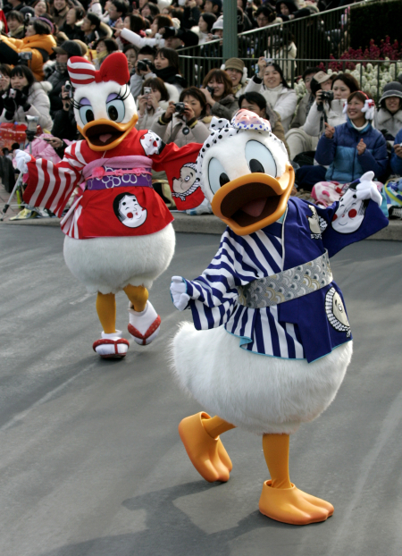 Disney characters Donald, right, and Daisy Duck, dressed in traditional Japanese outfits, perform at Tokyo Disneyland.