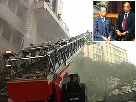 Firemen trying to rescue people trapped in the AMRI Hospital fire in Kolkata. (Inset) Emami Group founders R S Agarwal and R S Goenka.