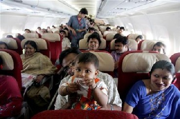 Passengers travel in a Kingfisher Airlines aircraft in the skies over New Delhi.