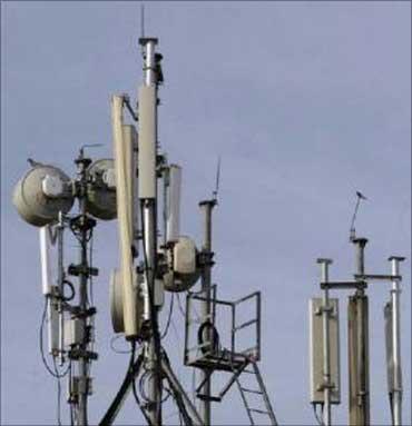 Birds sit atop telecommunication towers in Hyderabad.