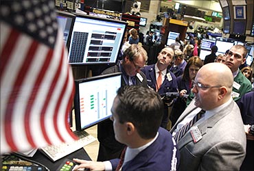 Traders work on the floor of the New York Stock Exchange.