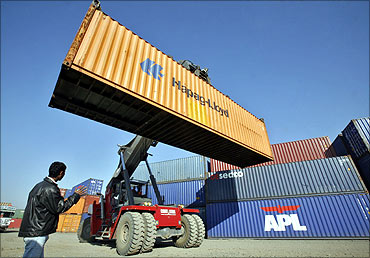 A stacker prepares to stack a container at Thar Dry Port in Sanand in Gujarat.