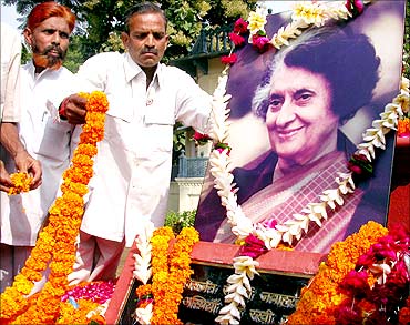 Activists of the Congress party lay garlands before the portrait of former PM Indira Gandhi.