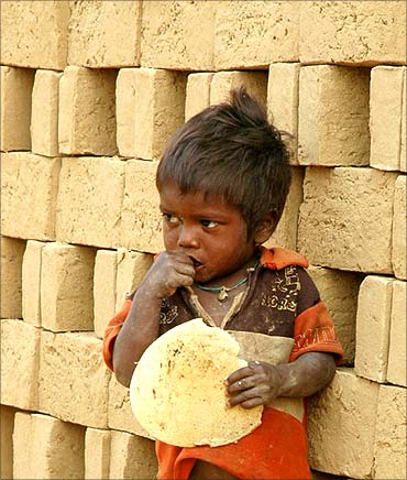 A child of an Indian brick kiln labourer.