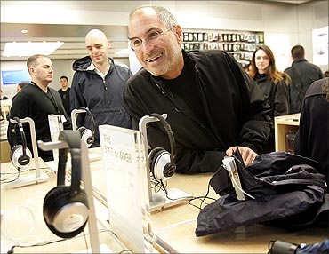 Steve Jobs smiles at the grand opening of the new Apple Store on 5th Avenue in New York, May 2006.