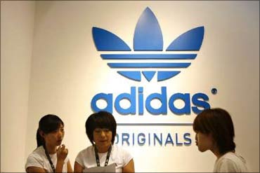 Customers at an Adidas store.