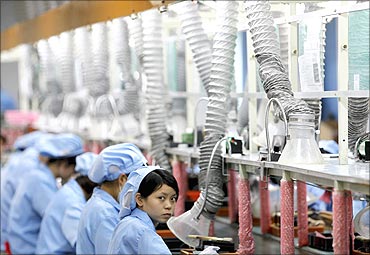 An employee at production line in Suzhou Etron Electronics Co in Suzhou.